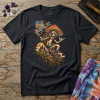 A sunglasses-wearing mushroom riding a skateboard past pines and a full moon, on a Black unisex t-shirt