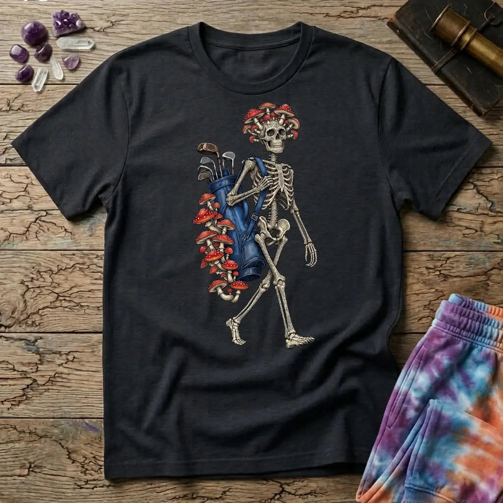 Skeleton carrying a navy golf bag with red amanita mushrooms sprouting from the clubs and skull, on a Black unisex t-shirt