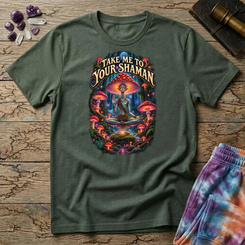 Take Me to Your Shaman lettering above a neon amanita-crowned figure meditating in a glowing forest, on a Military Green unisex t-shirt