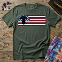 A black mushroom silhouette over an American flag of stars and stripes, on a Military Green unisex t-shirt