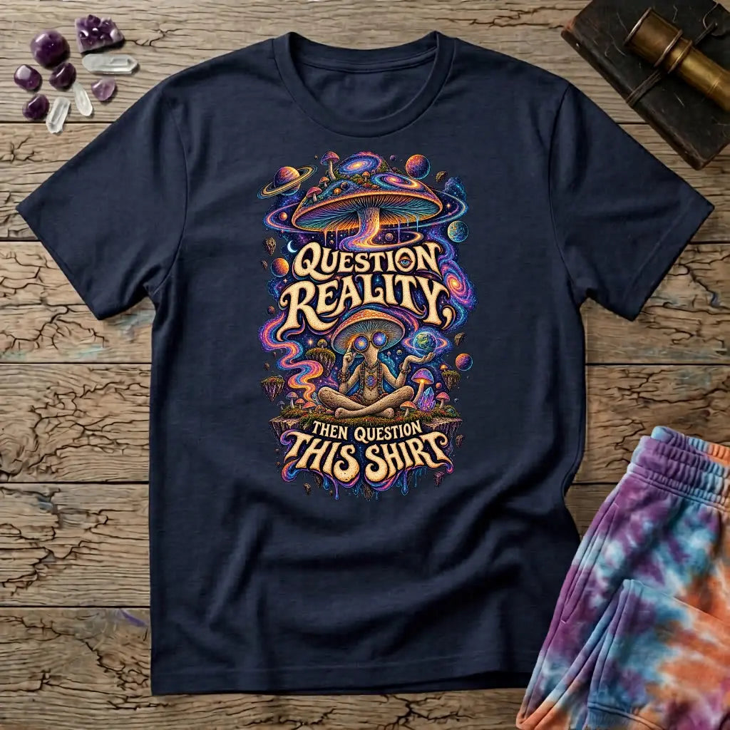 Question Reality, Then Question This Shirt lettering around a cosmic mushroom and a meditating figure, on a Navy unisex t-shirt