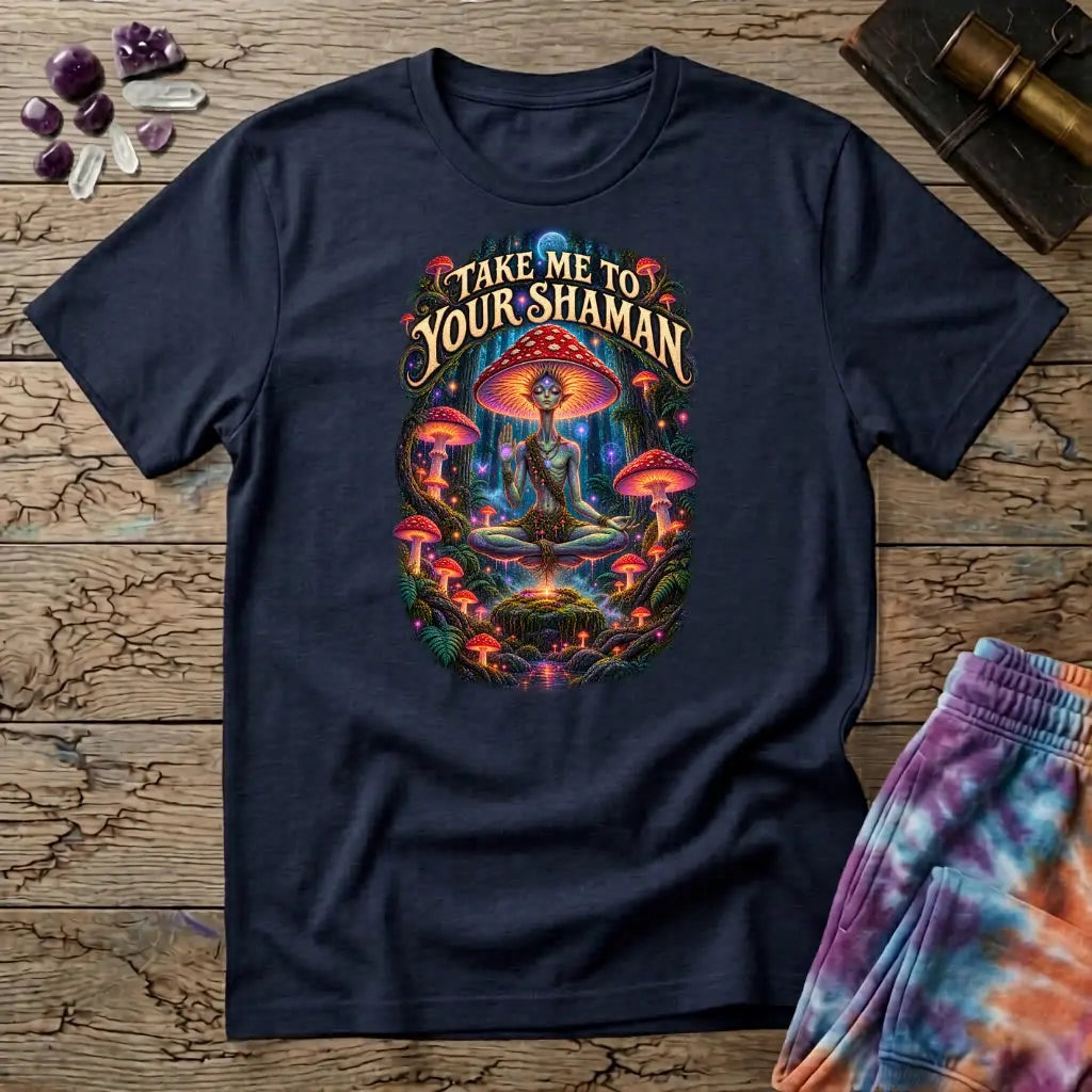 Take Me to Your Shaman lettering above a neon amanita-crowned figure meditating in a glowing forest, on a Navy unisex t-shirt