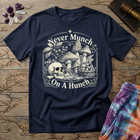 Never Munch on a Hunch engraved skull beside a foraging basket of wild mushrooms, on a Navy unisex t-shirt