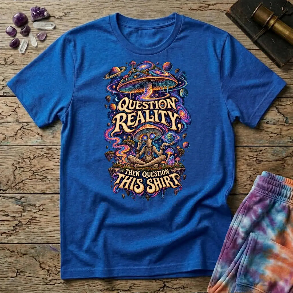 Question Reality, Then Question This Shirt lettering around a cosmic mushroom and a meditating figure, on a Royal blue unisex t-shirt