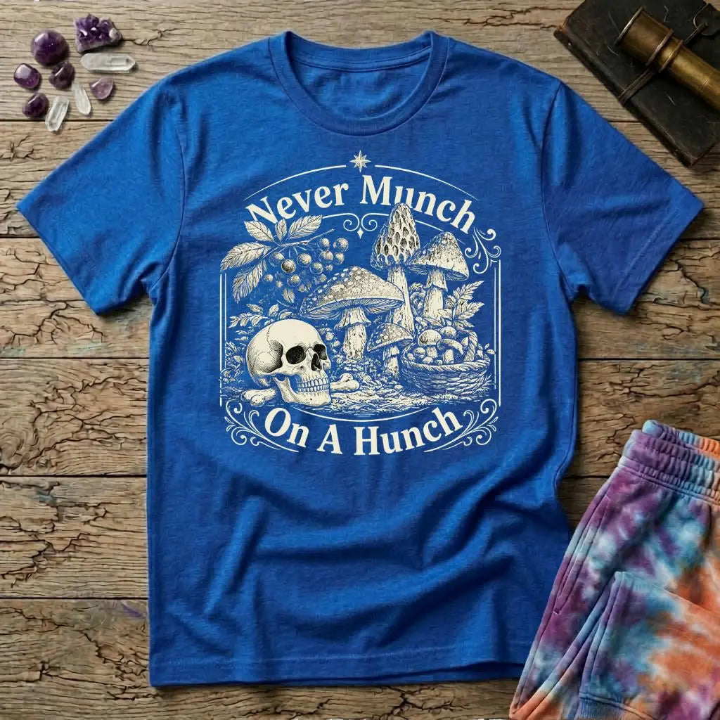 Never Munch on a Hunch engraved skull beside a foraging basket of wild mushrooms, on a Royal blue unisex t-shirt