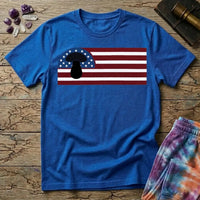 A black mushroom silhouette over an American flag of stars and stripes, on a Royal blue unisex t-shirt