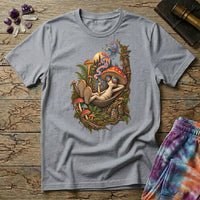 Mushroom character in round rainbow sunglasses relaxing in a hammock under a pine-lined moon, on a Sport Grey unisex t-shirt