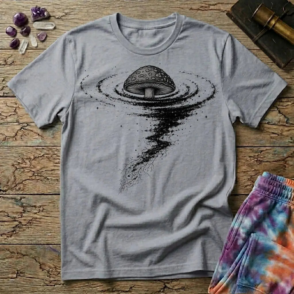 An inked mushroom above a spiraling tornado of stars and trailing roots, on a Sport Grey unisex t-shirt
