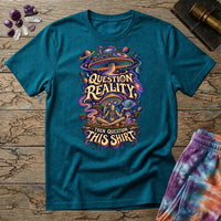 Question Reality, Then Question This Shirt lettering around a cosmic mushroom and a meditating figure, on a Tropical Blue unisex t-shirt