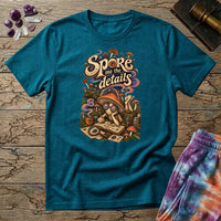 Spore Me the Details lettering above a mushroom character taking notes over spore prints, on a Tropical Blue unisex t-shirt