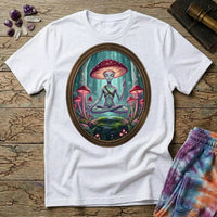 A mushroom-capped alien meditating on a mossy rock in an oval forest frame, on a White unisex t-shirt