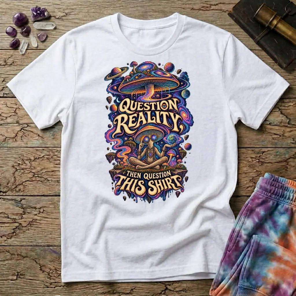 Question Reality, Then Question This Shirt lettering around a cosmic mushroom and a meditating figure, on a White unisex t-shirt