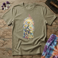 Daisies blooming from dripping mushrooms in front of a glowing sun mandala and rainbow trails, on a unisex t-shirt