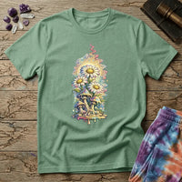 Daisies blooming from dripping mushrooms in front of a glowing sun mandala and rainbow trails, on a unisex t-shirt