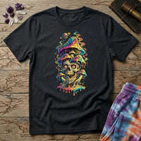 Grinning skull with hypnotic swirling eyes beneath a stack of dripping rainbow mushrooms and a small Saturn, on a unisex t-shirt