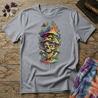 Grinning skull with hypnotic swirling eyes beneath a stack of dripping rainbow mushrooms and a small Saturn, on a unisex t-shirt