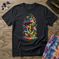 Cluster of neon mushrooms dripping color into a glowing puddle with rainbow tendrils and a floating planet, on a unisex t-shirt