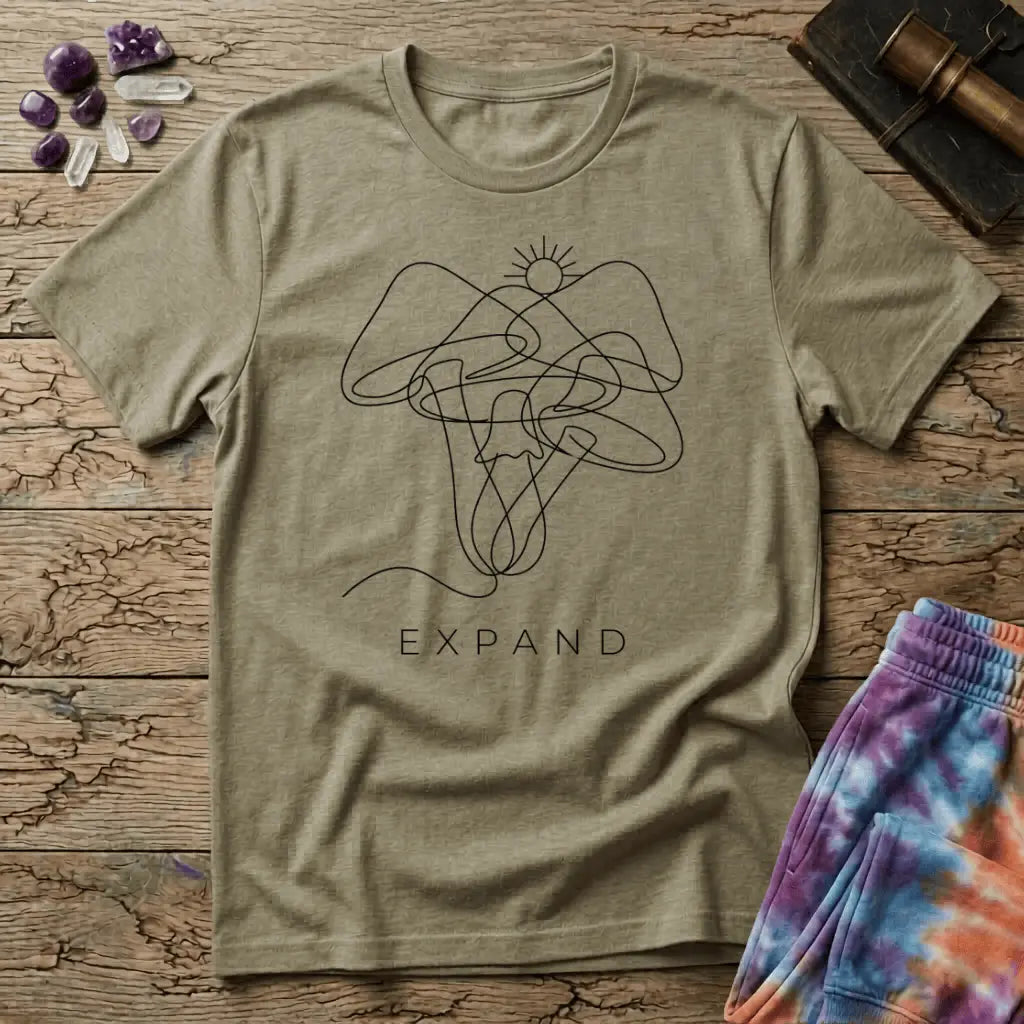 Single unbroken line tracing a rising sun into a cluster of mushroom caps and stems, minimalist line art, on a unisex t-shirt