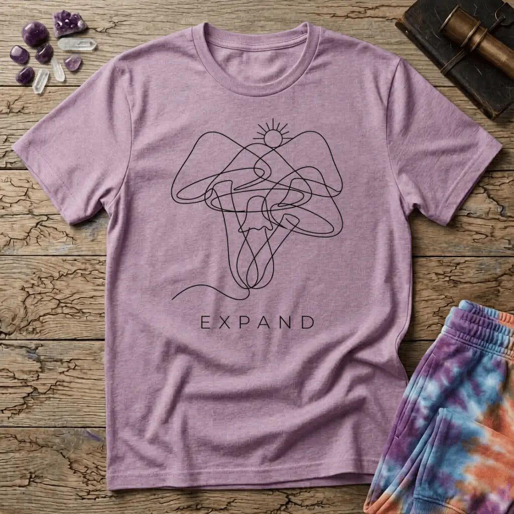 Single unbroken line tracing a rising sun into a cluster of mushroom caps and stems, minimalist line art, on a unisex t-shirt