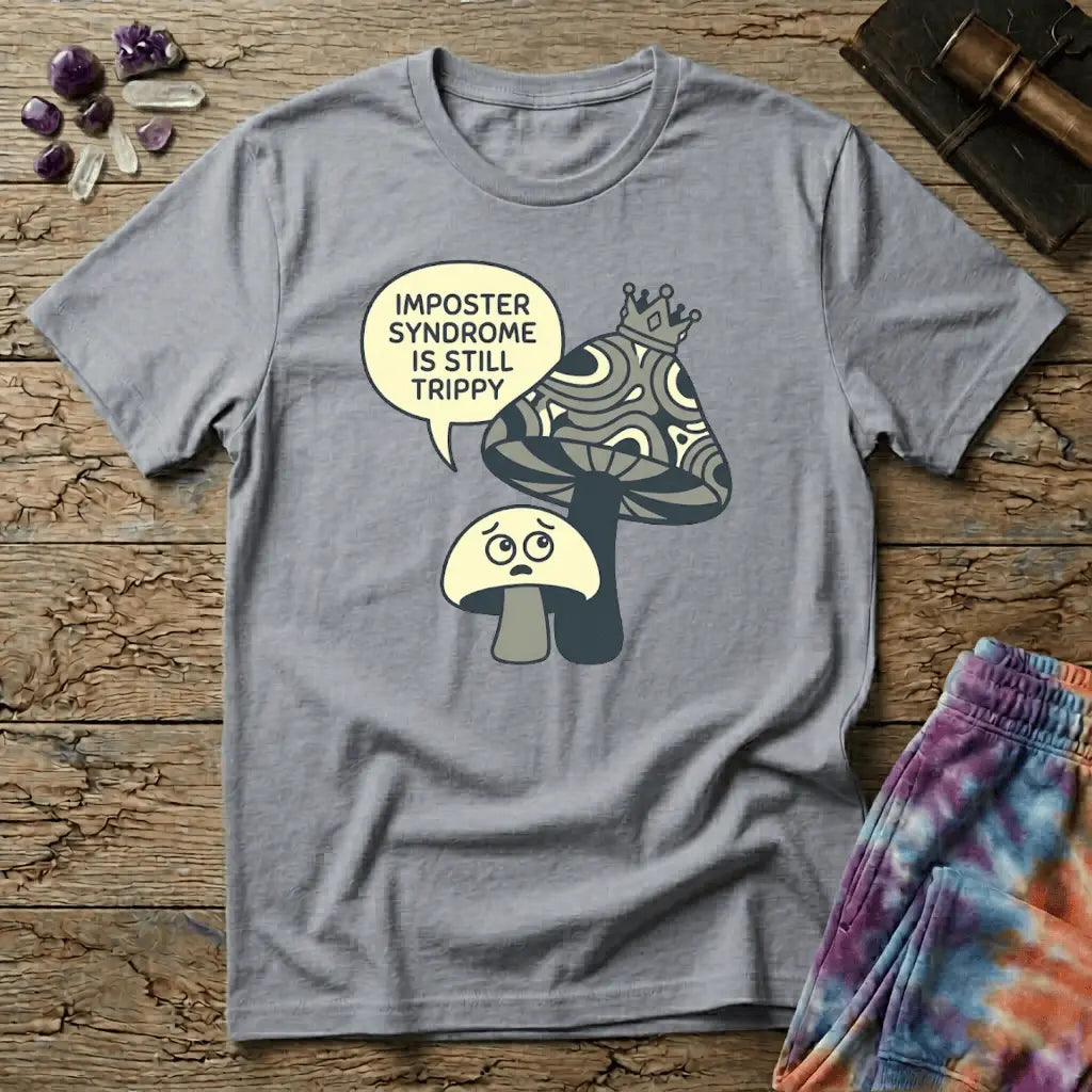 Small worried mushroom beside a larger crowned one, captioned imposter syndrome is still trippy, on a unisex t-shirt