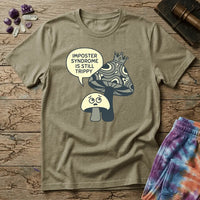 Small worried mushroom beside a larger crowned one, captioned imposter syndrome is still trippy, on a unisex t-shirt