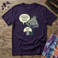 Small worried mushroom beside a larger crowned one, captioned imposter syndrome is still trippy, on a unisex t-shirt