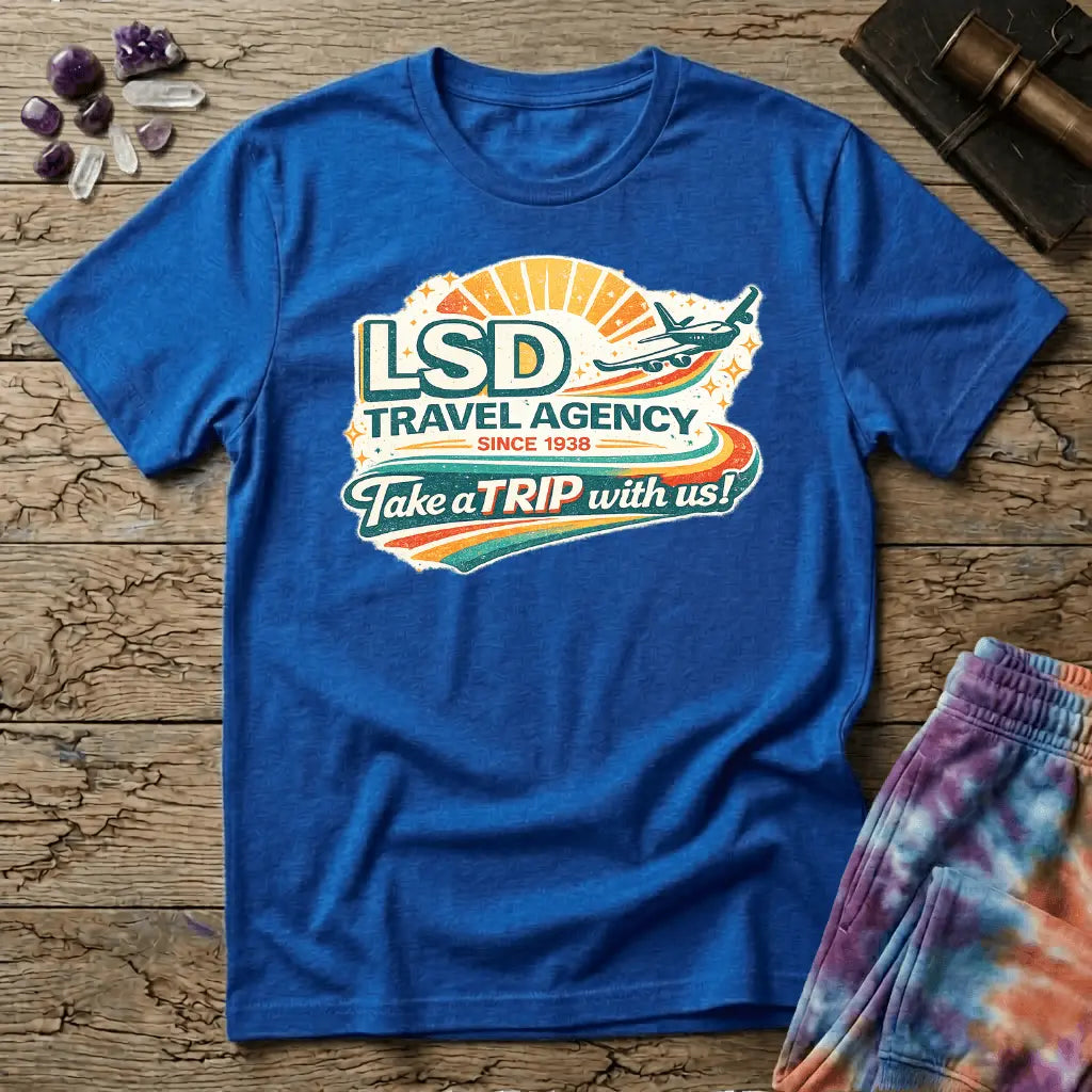 Retro airline-style badge with a plane soaring past a golden sunburst and rainbow streaks, reading LSD Travel Agency, on a unisex t-shirt