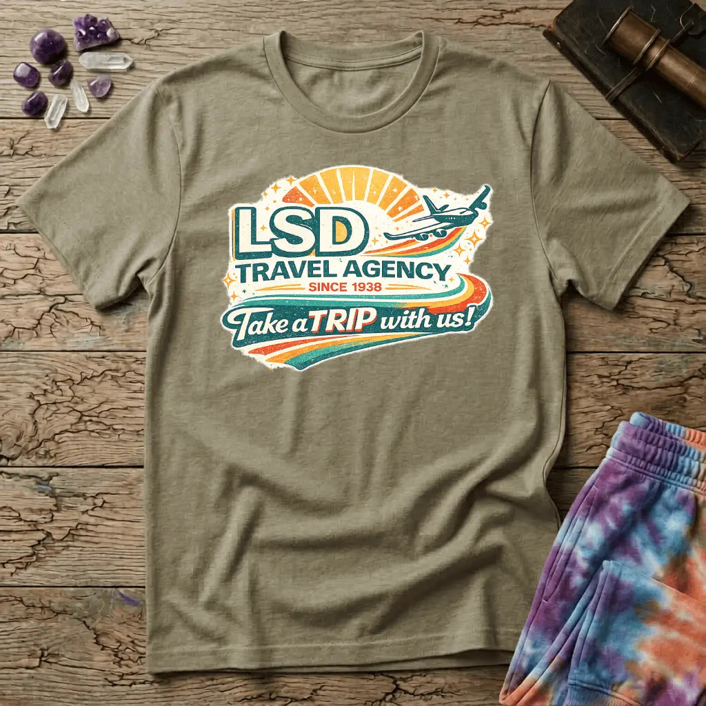 Retro airline-style badge with a plane soaring past a golden sunburst and rainbow streaks, reading LSD Travel Agency, on a unisex t-shirt