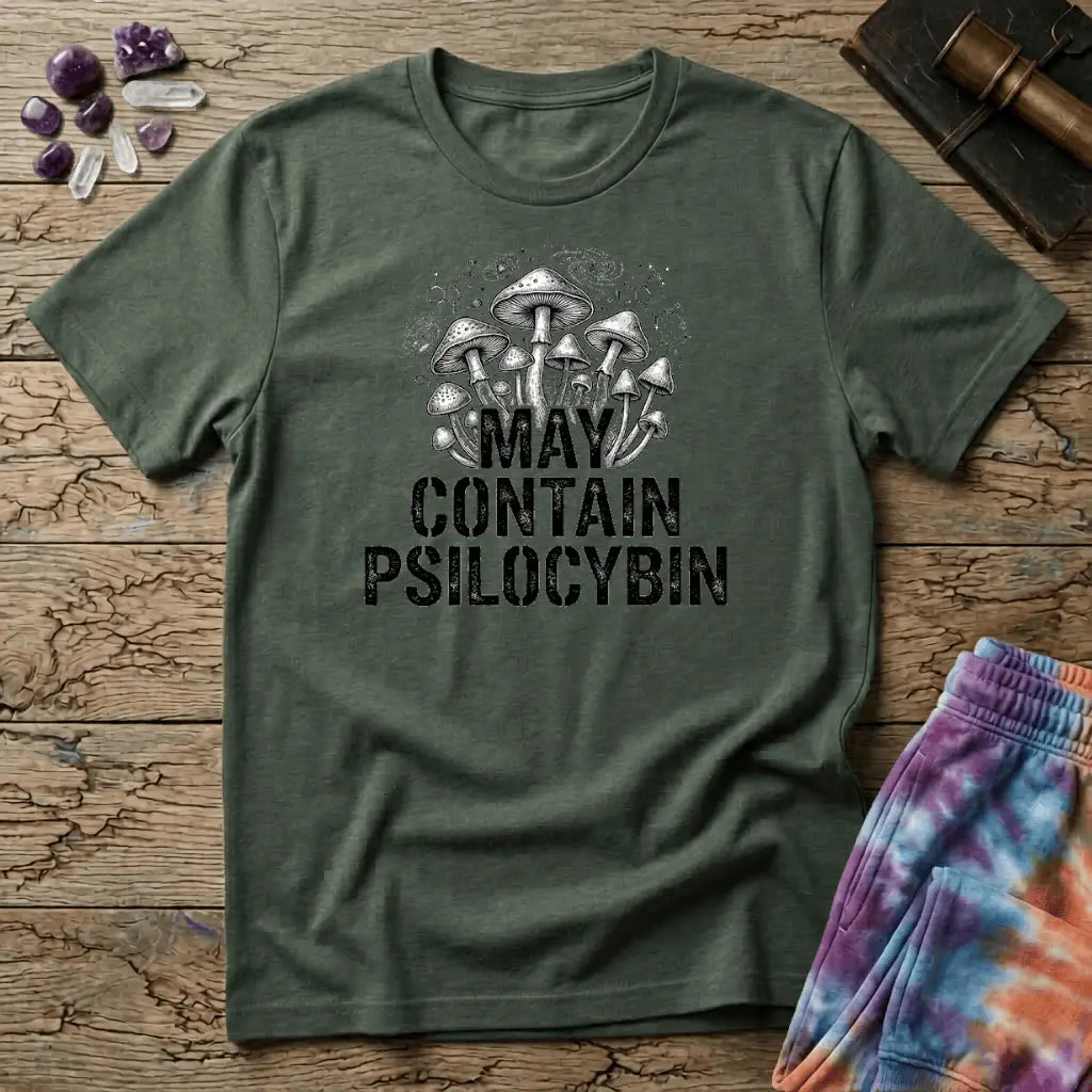Hand-drawn mushrooms growing out of distressed May Contain Psilocybin lettering over faint molecular hexagons, on a unisex t-shirt