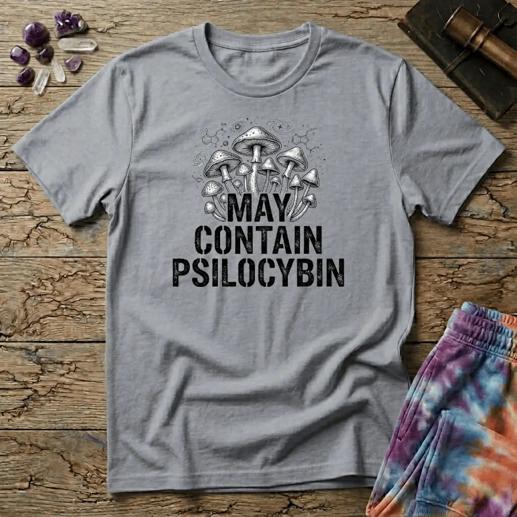 Hand-drawn mushrooms growing out of distressed May Contain Psilocybin lettering over faint molecular hexagons, on a unisex t-shirt