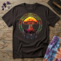 Watercolor mushroom in fiery reds and oranges framed by an ornate Celtic knotwork ring with roots trailing below, on a unisex t-shirt