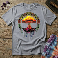 Watercolor mushroom in fiery reds and oranges framed by an ornate Celtic knotwork ring with roots trailing below, on a unisex t-shirt