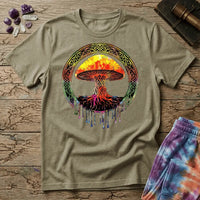 Watercolor mushroom in fiery reds and oranges framed by an ornate Celtic knotwork ring with roots trailing below, on a unisex t-shirt